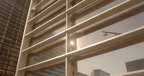 The sun reflects off the windows of an office building Stock Footage 143877939