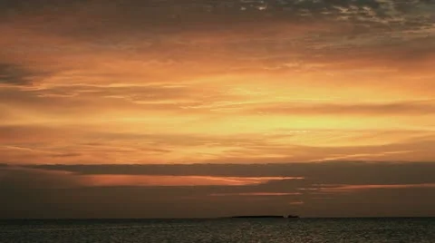Sun rise in orange sky time lapse Stockbeeldmateriaal 22635147