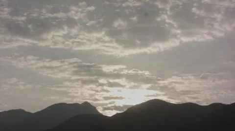 Sun Rise Over The Mountain With Fast Blowing Clouds Timelapse HD Stock Footage 46475054