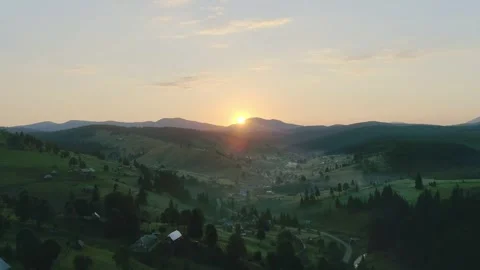 Sun rise under mountain valley, sunrise casting golden Stock Footage 316898541