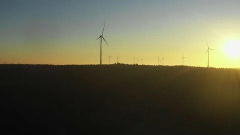 Sun rise at a wind farm in the forest2 Stock Footage 146033376