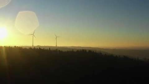 Sun rise at a wind farm in the forest3 Stock Footage 146033377