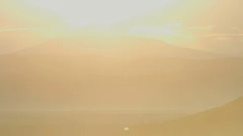 The sun rises and floods the frame with light Stock Footage 78588812