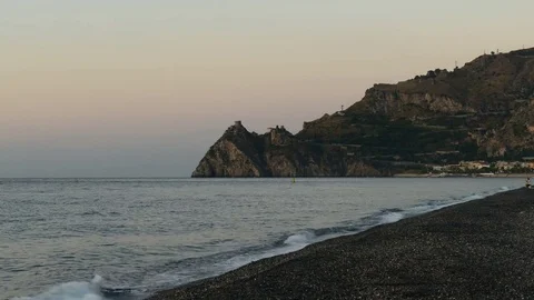 The sun rises on the beach of Sant'alessio Siculo Stock Footage 82962153