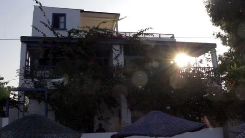 Sun rises behind beach side holiday apartment Stock Footage 85299743