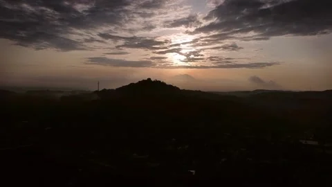The sun rises behind the cold mountains Stock Footage 278870816