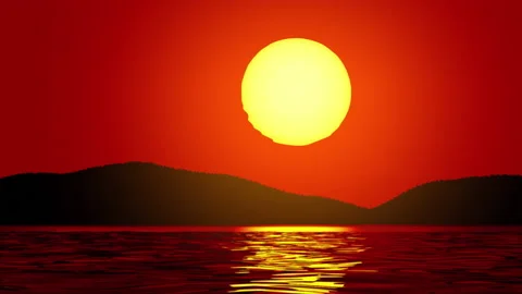 The sun rises from behind the hills and the sea shore Stock Footage 181565545