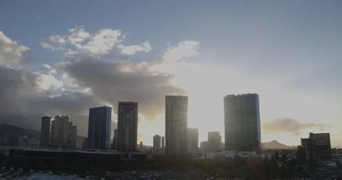 The sun rises behind Honolulu City Hawaii Stock Footage 137664701