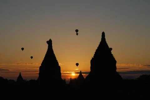 The sun rises between two pagodas, Bagan, Myanmar Stock Photos