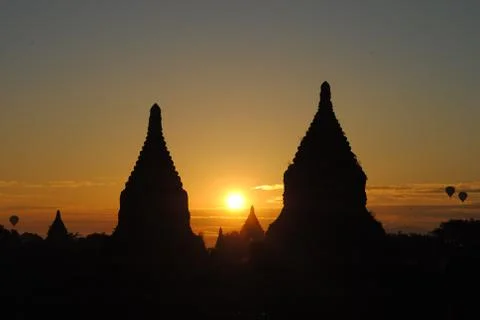 The sun rises between two pagodas, Bagan, Myanmar Stock Photos