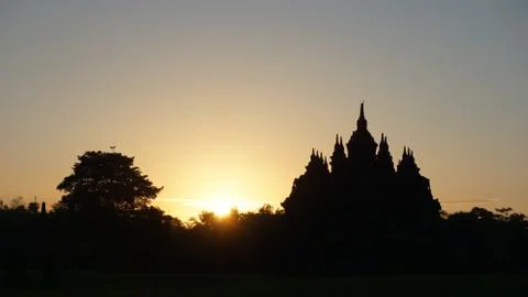 The sun rises early summer with the foreground of a temple 写真素材