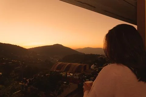 The sun rises Orange light behind a big mountain Foto stock