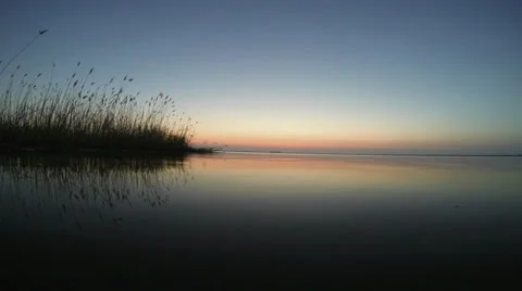 The sun rises over the lake Stock Footage 37131578