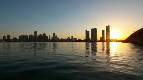 The sun rises over the miami skyline and biscayne bay Stock Footage 312534996