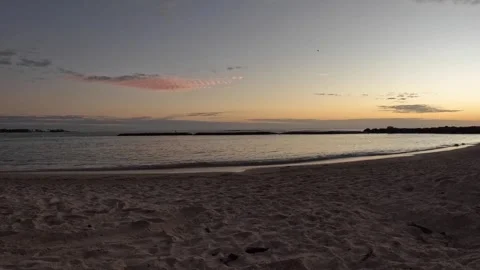 The Sun Rises Over Sandy Mexican Beach as Waves Lap Against the Shore 動画素材 278495003