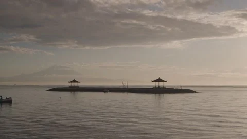 The sun rises over Sanur Beach, a famous beach in Bali east. Indonesia Stock Footage 308296582