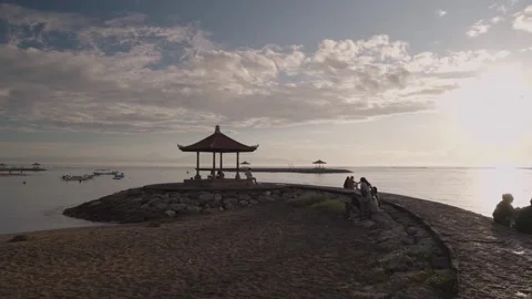 The sun rises over Sanur Beach, a famous beach in Bali east. Indonesia Stock Footage 308297037
