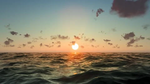 A sun rises over the sea at dawn. Stock Footage 336088456