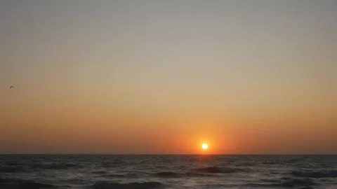 The sun rises over the sea or ocean at dawn Stock Footage 114910731