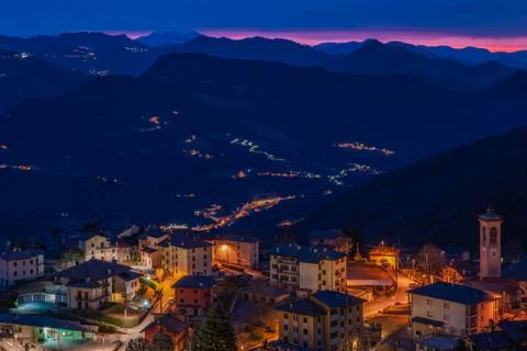 The sun rises over a small mountain village Stock Photos