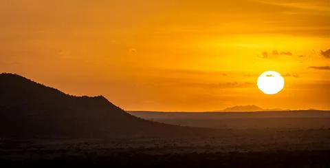 The Sun rises over Spitzkoppe in Namibia Foto stock