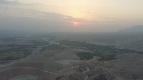 The sun rises over the valley in Nangarhar Stock Footage 274536863
