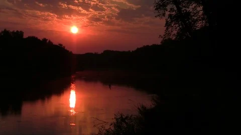 The sun rises over the Wild River Video stock 84379954