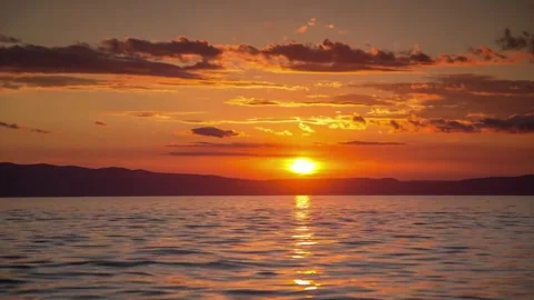 The sun rises from the sea Stock Footage 243907865