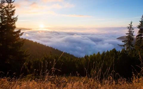 Sun Rises Through The Cloud Inversion, Sunrise On The Mountains Stock Photos