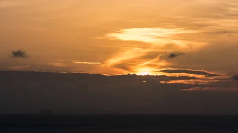Sun rises through clouds at dawn Stock-Footage 58387379