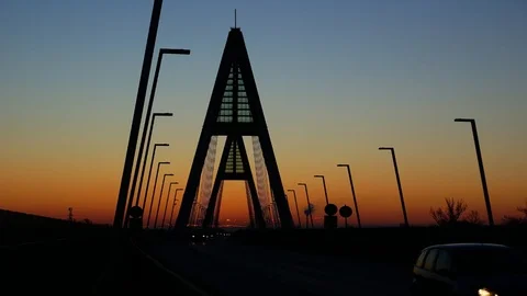 The sun rises while morning rush hour traffic on the Bridge Stock Footage 112440893
