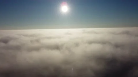 Sun is rising above the endless sea of clouds until the horizon. 4K drone in sky Stock Footage 168599751