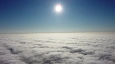 Sun is rising above the endless sea of clouds until the horizon. 4K drone in sky Stock Footage 168599772
