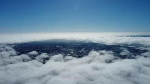 Sun is rising above the endless sea of clouds until the horizon. 4K drone in sky Stock Footage 168599835