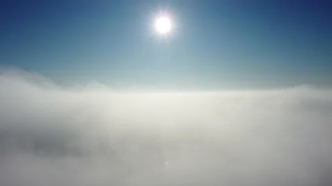 Sun is rising above the endless sea of clouds until the horizon. 4K drone in sky Stock Footage 168599854