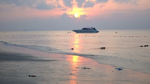 Sun Rising Above Ocean With Waves Hitting Tropical Island Beach Stock Footage 120330805