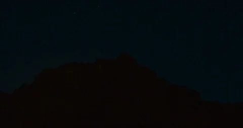 Sun rising behind a hill. Stock Footage 88374168