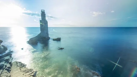 Sun rising behind lighthouse Gisborne, New Zealand Stock Footage 83892508