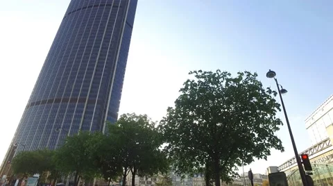 Sun rising behind the Montparnasse tower (Tour Montparnasse) in Paris, France Stock Footage 63046696