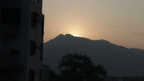 Sun Rising Behind from the mountain Stock Footage 256151985