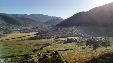 Sun rising from behind the mountain hill of picturesque Italian countryside Stock Footage 345220358