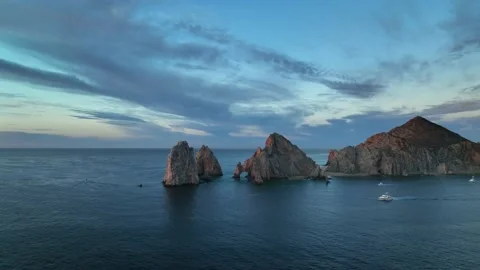 Sun rising up on Land's End Cabo San Lucas Arch in Baja Mexico Stock Footage 236741176