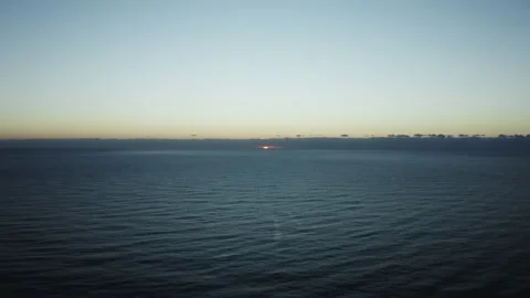 Sun rising in the ocean Stock Footage 190613939