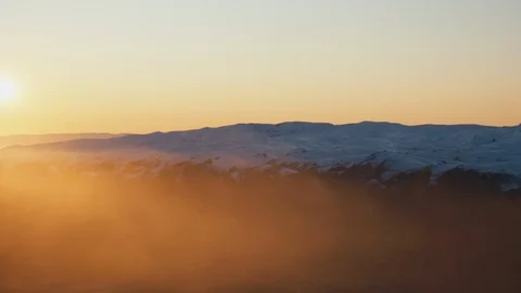 Sun rising over alpine mountains in Wanaka, New Zealand Stock Footage 90325544
