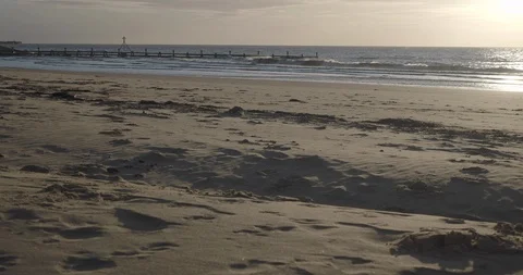 Sun rising over beach Stock Footage 124987206