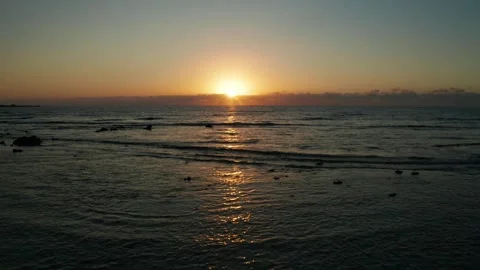 Sun rising over a calm sea Stock Footage 345521587