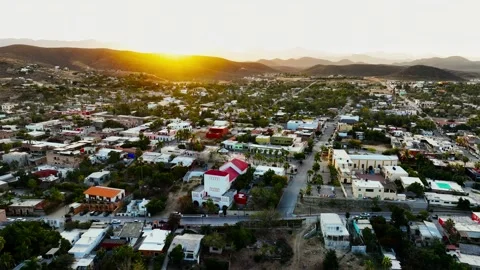 Sun rising over the mountains shining on Todos Santos Stock Footage 236741219