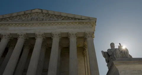 Sun Rising Over Statue At U.S. Supreme Court Building In Washington D.C. Video stock 237297099