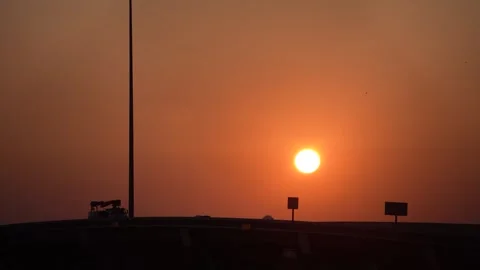 Sun Rising Over Traffic Silhouette Stock Footage 285370175