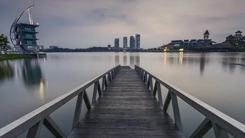 Sun rising at Pullman jetty, Putrajaya. Pan Up, Zoom In Timelapse Motion Stock Footage 83016772